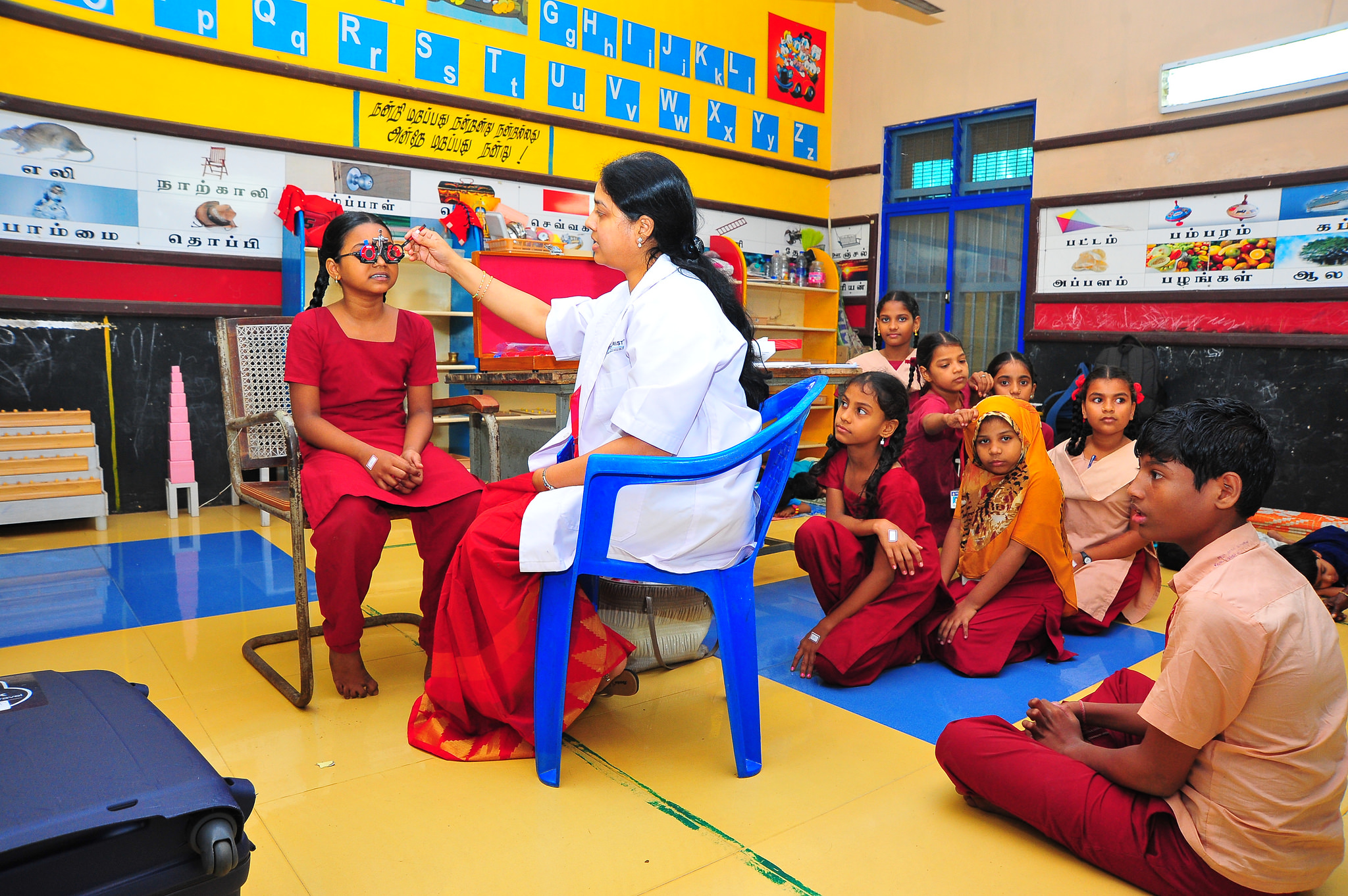 Eye screening in progress in a classroom. INDIA