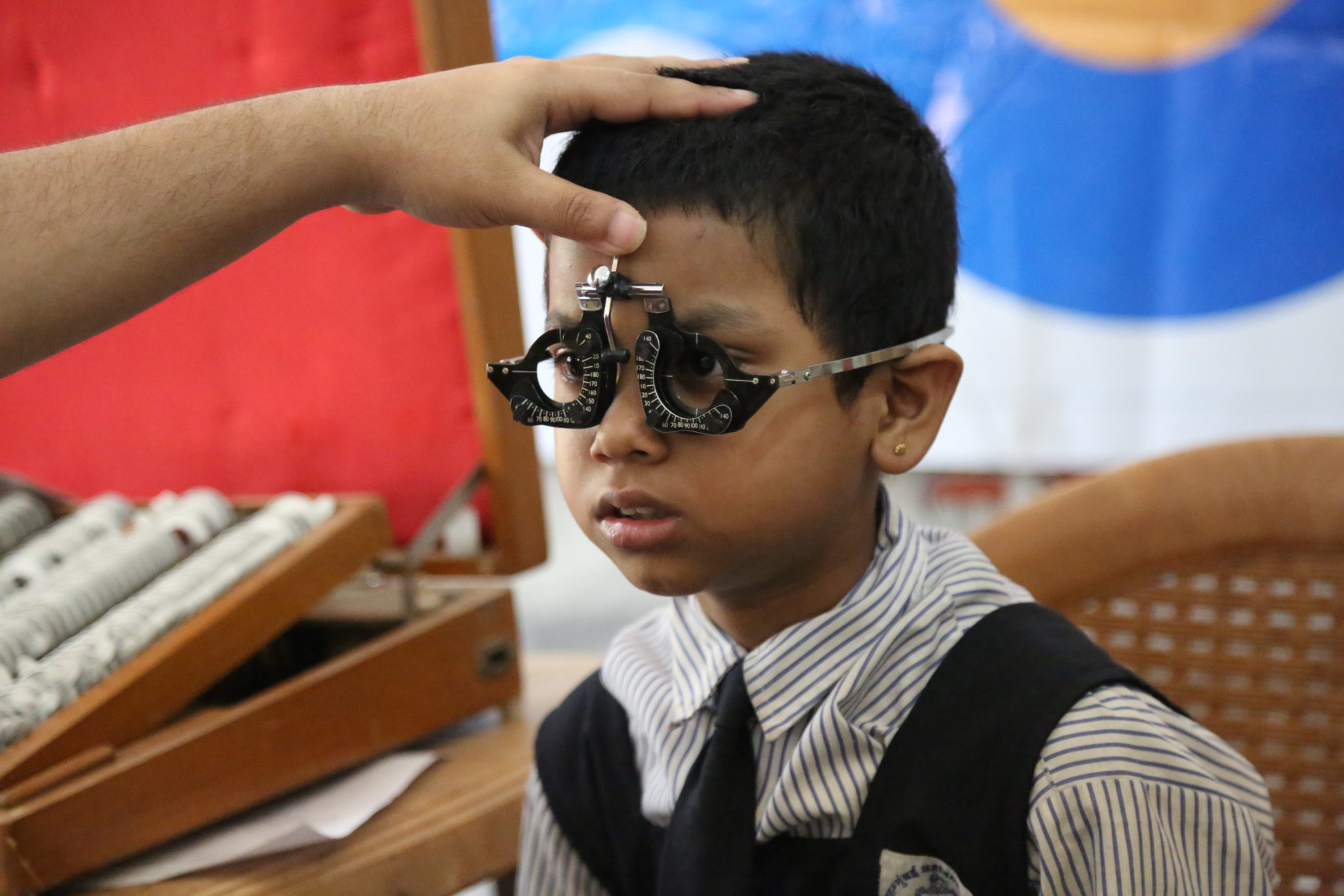A child is measured for spectacles. INDIA (c)UMESH WARISE, COURTESY OF IAPB
