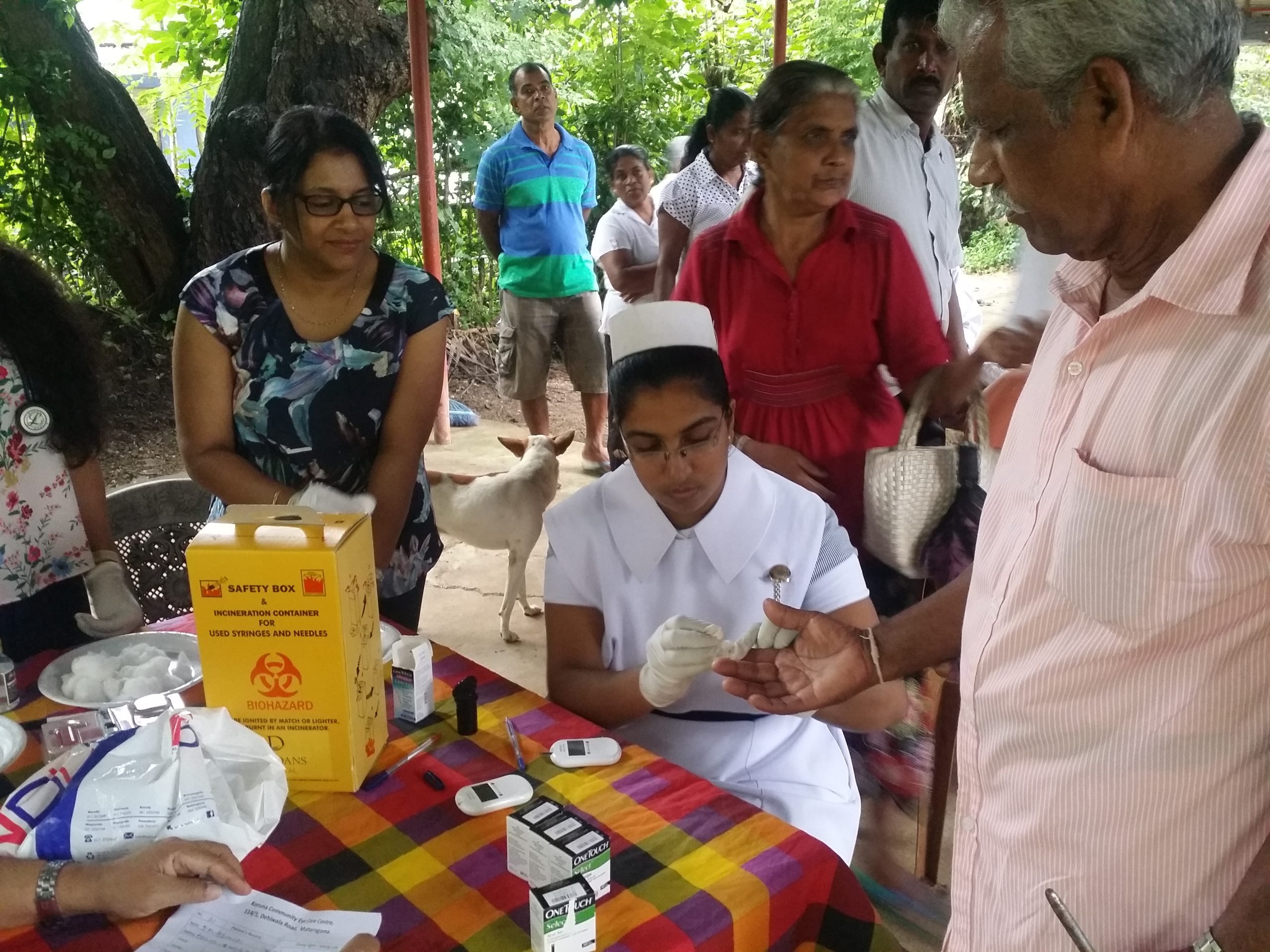 A nurse attends to a patient at Lions Eye Hospital, Ratnapura