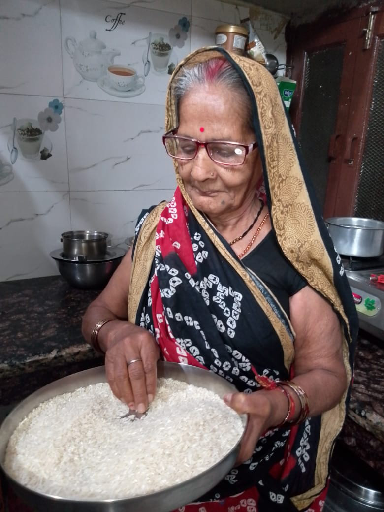 A cataract patient carrying out her daily tasks with ease after a successful operation, India.